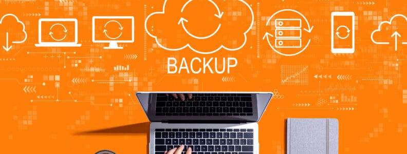 Backup concept with person using a laptop