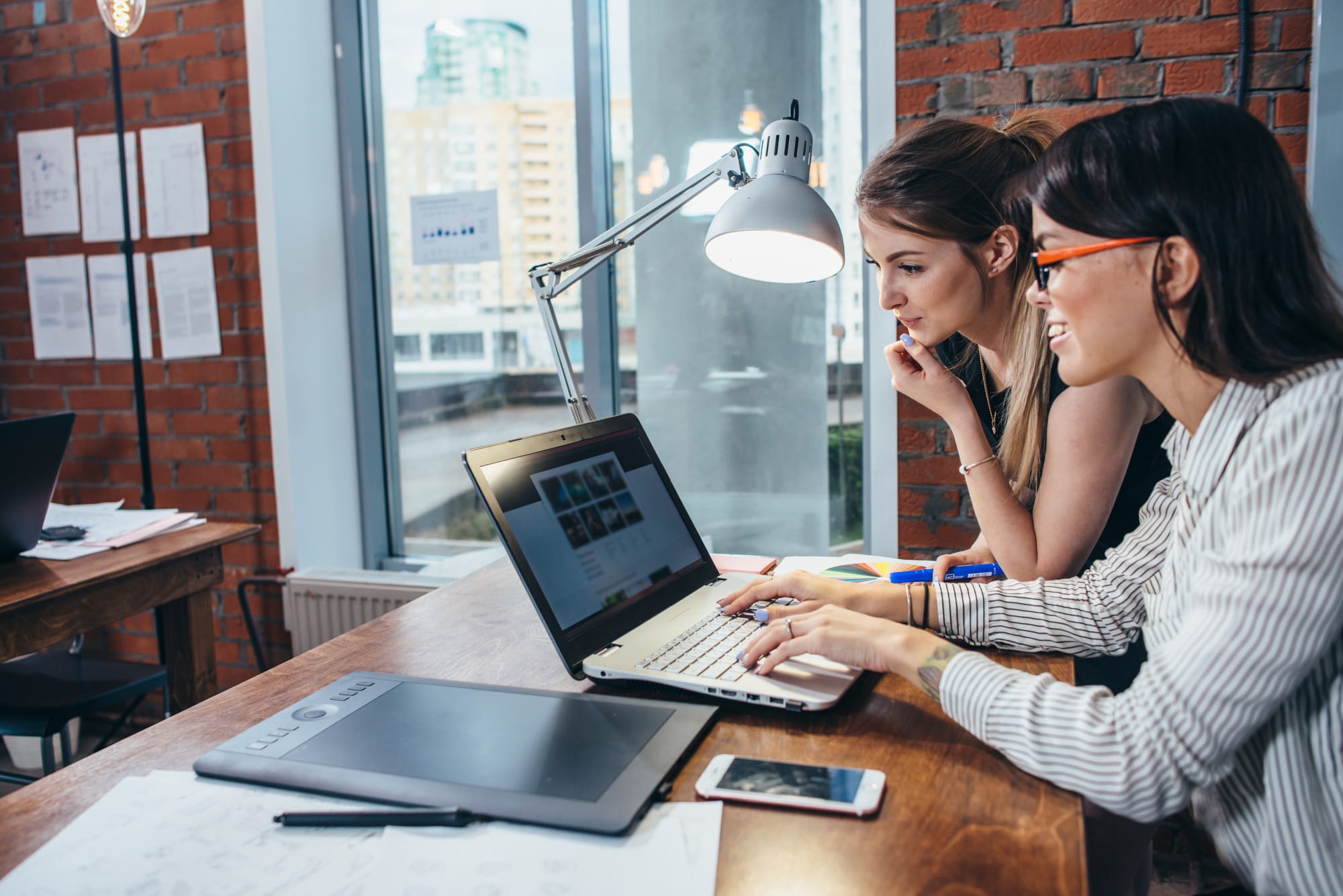 two people searching for managed IT services